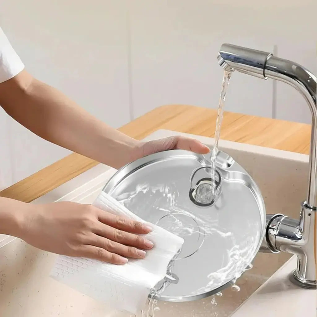 Easy-clean stainless steel cat fountain bowl being rinsed under running tap
