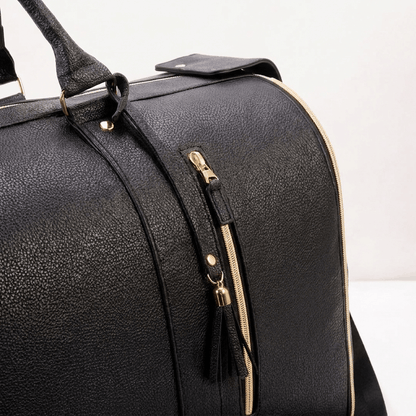Bag with handle extended on a concourse
