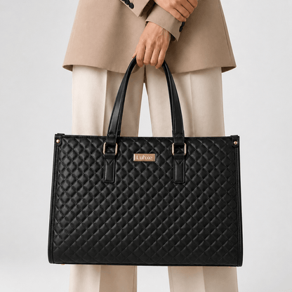 Tote held by hand